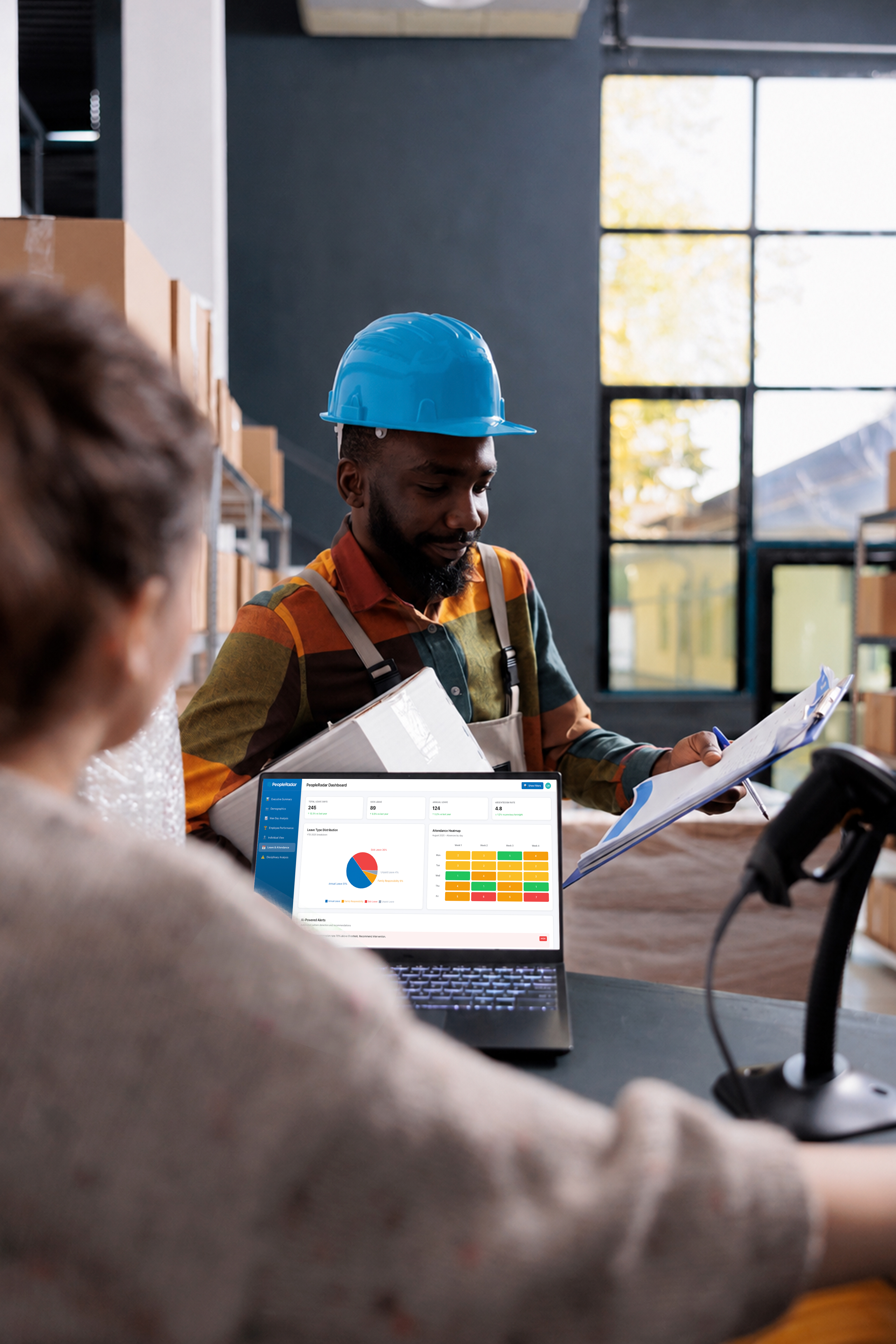 Warehouse team reviewing workforce data on the PeopleRadar dashboard